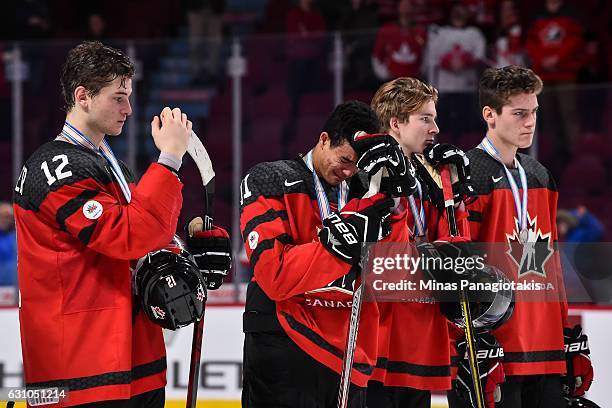 Members of Team Canada react after losing to Team United States during the 2017 IIHF World Junior Championship gold medal game at the Bell Centre on...