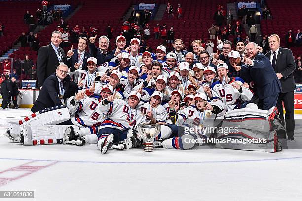 Team United States poses for a team photo after defeating Team Canada and winning the gold medal round during the 2017 IIHF World Junior Championship...
