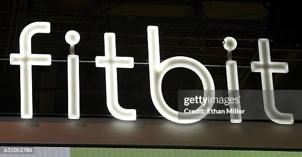 Sign at the Fitbit booth is shown at CES 2017 at the Sands Expo and Convention Center on January 5, 2017 in Las Vegas, Nevada. CES, the world's...