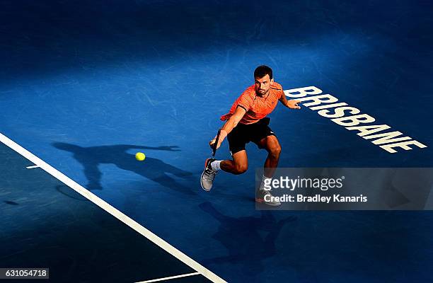 Grigor Dimitrov of Bulgaria plays a backhand against Dominic Thiem of Austria on day six of the 2017 Brisbane International at Pat Rafter Arena on...