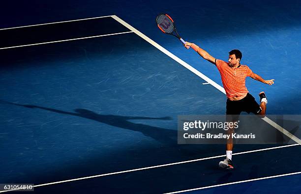 Grigor Dimitrov of Bulgaria plays a backhand against Dominic Thiem of Austria on day six of the 2017 Brisbane International at Pat Rafter Arena on...