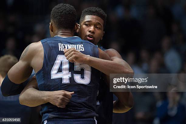 Villanova Wildcats forward Darryl Reynolds and Villanova Wildcats forward Kris Jenkins hug during player introductions before the NCAA men's...