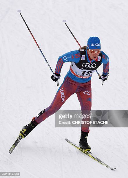 Yulia Tchekaleva of Russia competes in the ladies' 10 kilometers pursuit free style competition of the "Tour de Ski" Cross Country World Cup on...