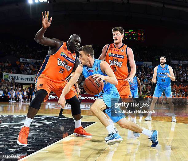 David Stockton of the Breakers drives to the basket past Nathan Jawai of the Taipans during the round 14 NBL match between the Cairns Taipans and the...