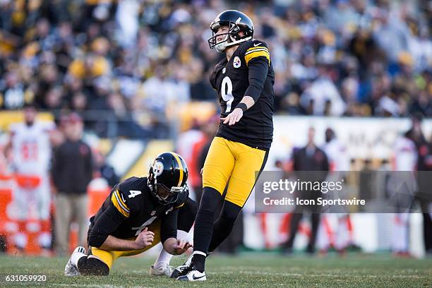 Pittsburgh Steelers Place Kicker Chris Boswell kicks an extra point out of the hold of Pittsburgh Steelers Punter Jordan Berry during the fourth...