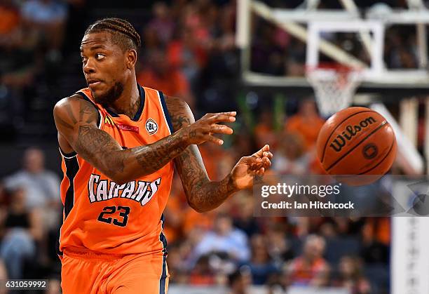 Fuquan Edwin of the Taipans passes the ball during the round 14 NBL match between the Cairns Taipans and the New Zealand Breakers at Cairns...