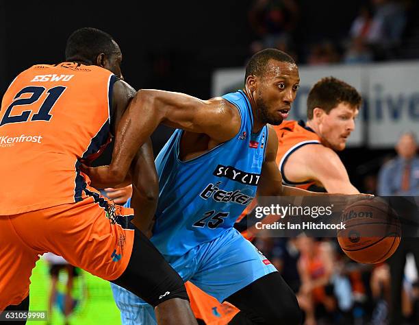 Akil Mitchell of the Breakers drives to the basket past Nnanna Egwu of the Taipans during the round 14 NBL match between the Cairns Taipans and the...