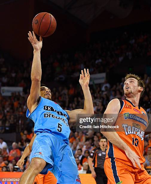 Shea Lli of the Breakers takes a shot over Mitch McCarron of the Taipans during the round 14 NBL match between the Cairns Taipans and the New Zealand...