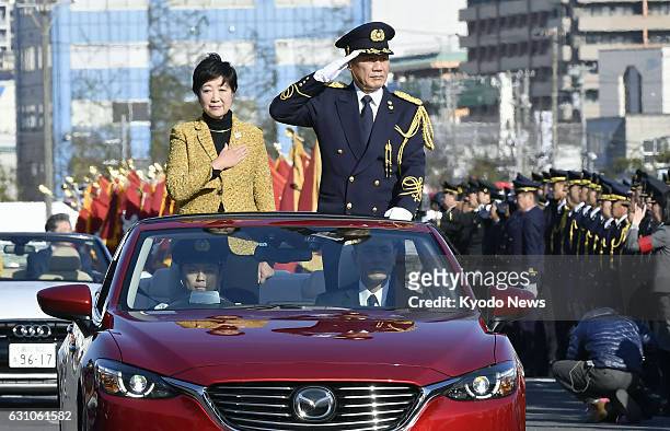 Tokyo Gov. Yuriko Koike and Jun Takahashi, the fire chief of the Tokyo Fire Department, take part in the annual New Year parade of fire brigades...