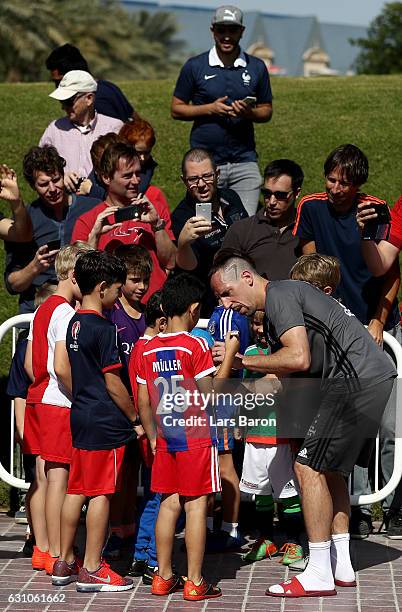 Franck Ribery signes autographs during a training session at day 4 of the Bayern Muenchen training camp at Aspire Academy on January 6, 2017 in Doha,...