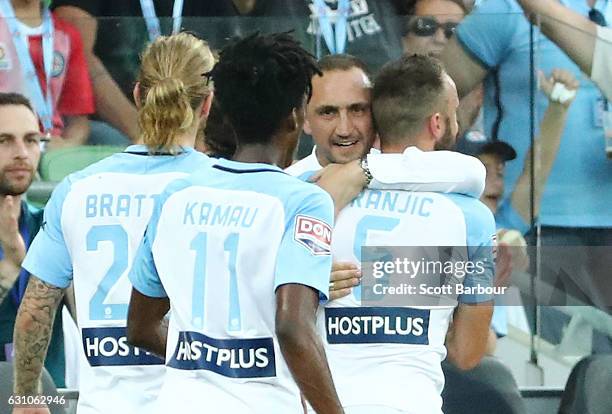 Ivan Franjic of City FC celebrates after scoring the first goal with City FC interim coach Michael Valkanis during the round 14 A-League match...