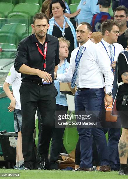 City FC interim coach Michael Valkanis shakes hands with Wanderers coach Tony Popovic after the round 14 A-League match between Melbourne City FC and...