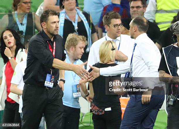 City FC interim coach Michael Valkanis shakes hands with Wanderers coach Tony Popovic after the round 14 A-League match between Melbourne City FC and...