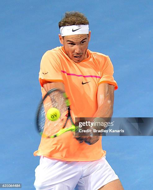 Rafael Nadal of Spain plays a backhand against Milos Raonic of Canada on day six of the 2017 Brisbane International at Pat Rafter Arena on January 6,...