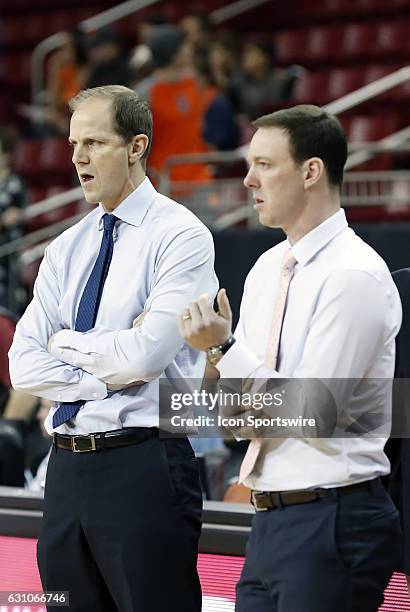 Syracuse University Orange head coach - designate Mike Hopkins and Syracuse University Orange assistant coach Gerry McNamara watch warm up before an...