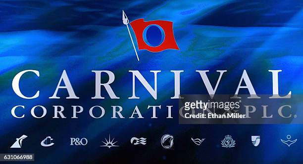 Carnival Corp. Logo is shown on a screen as President and CEO of Carnival Corp. Arnold W. Donald delivers a keynote address at CES 2017 at The...
