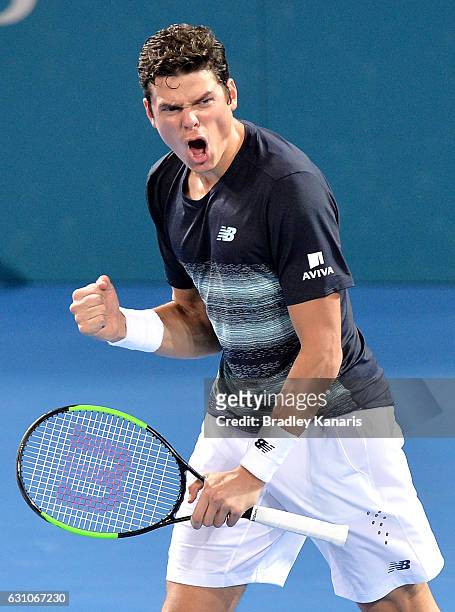 Milos Raonic of Canada celebrates victory after his match against Rafael Nadal of Spain on day six of the 2017 Brisbane International at Pat Rafter...