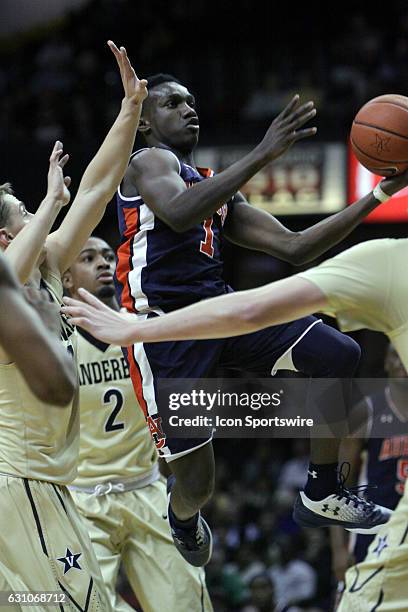 Auburn Tigers guard Jared Harper gets a shot off in a crowd of Vanderbilt Commodore defenders during the second half of Auburn's 80-61 loss to...