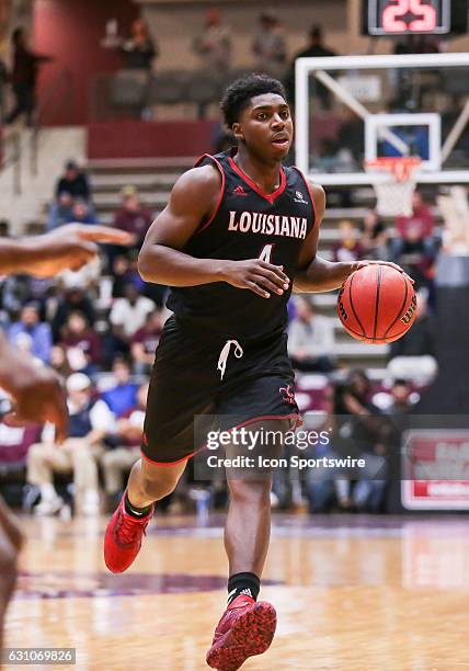 Louisiana Lafayette Ragin Cajuns guard Frank Bartley IV brings the ball up court during an NCAA basketball game between the University of Louisiana...