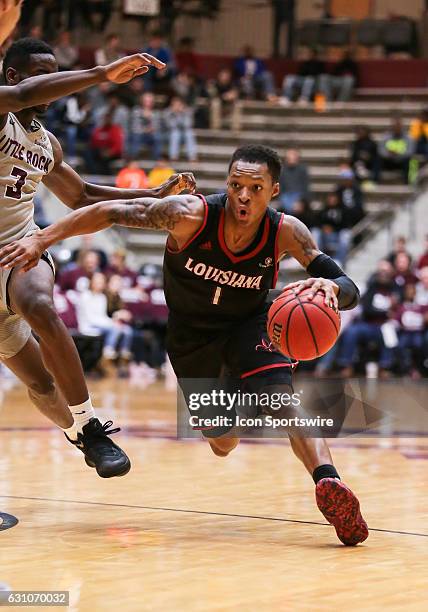 Louisiana Lafayette Ragin Cajuns guard Jay Wright drives to the basket during an NCAA basketball game between the University of Louisiana at...