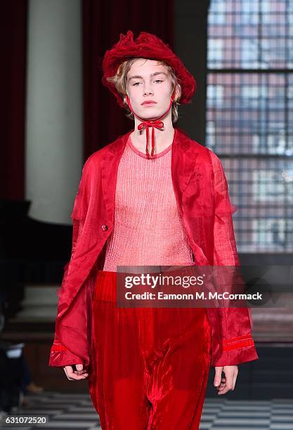 Model walks the runway at the WENTAO SHI - LCF MA17 show during London Fashion Week Men's January 2017 collections at St John's Smith Square on...