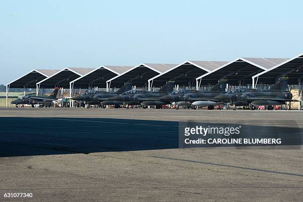 French Rafale fighter jets are parked on the tarmac during a visit of the French President to present New Year wishes to the French armed forces at...
