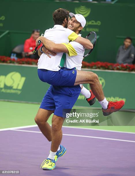 Jeremy Chardy and Fabrice Martin of France celebrate beating Vasek Pospisil of Canada and Radek Stepanek of Czech Republic in their doubles final...