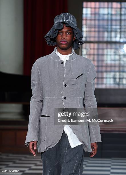 Model walks the runway at the PENG TAI - LCF MA17 show during London Fashion Week Men's January 2017 collections at St John's Smith Square on January...