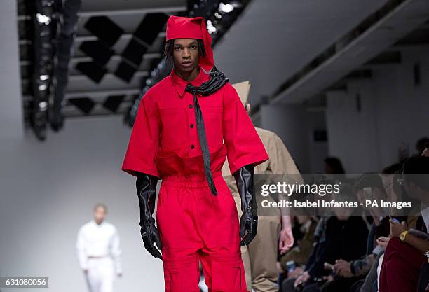 Models on the catwalk during the Xander Zhou London Fashion Week Men's AW17 show held at The Store Studios, Strand, London