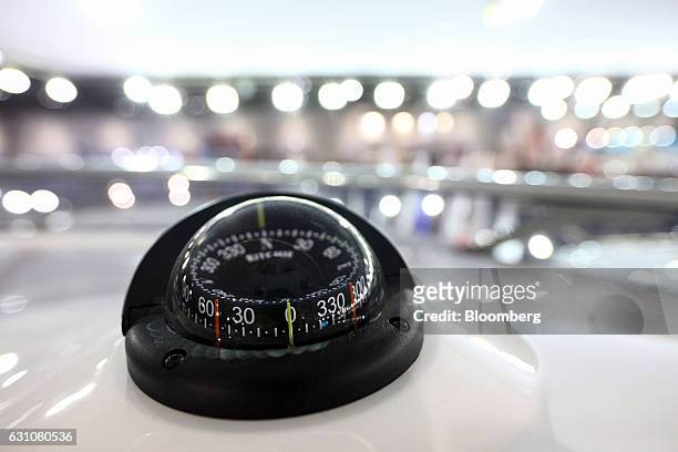 Navigation aid stands on the deck of a 95 yacht, manufactured by Sunseeker International Ltd., at the London Boat Show in London, U.K., on Friday,...