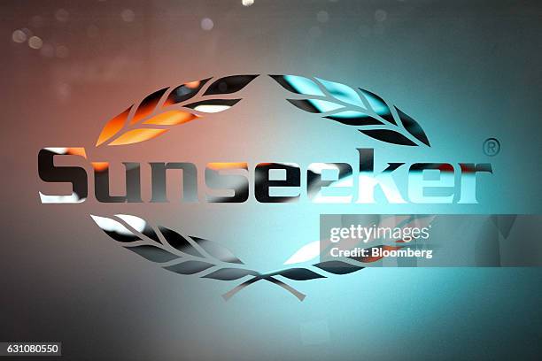 Sunseeker International Ltd. Sign is displayed on a frosted glass screen the London Boat Show in London, U.K., on Friday, Jan. 6, 2017. Boats are...