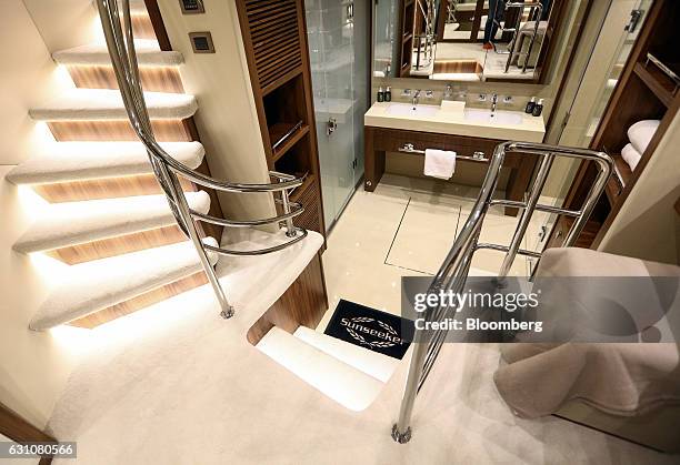 Stairway descends to a bathroom on board a 95 yacht, manufactured by Sunseeker International Ltd., at the London Boat Show in London, U.K., on...