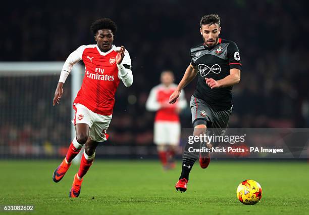 Arsenal's Ainsley Maitland-Niles and Southampton's Sam McQueen battle for the ball