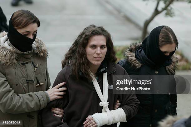 Year old Konstantina Athanasopoulou is escorted by anti-terrorist police officers coming out of the offices of prosecutors in a court in Athens, on...