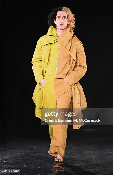 Model walks the runway at the Alex Mullins show during London Fashion Week Men's January 2017 collections at BFC Presentation Space on January 6,...