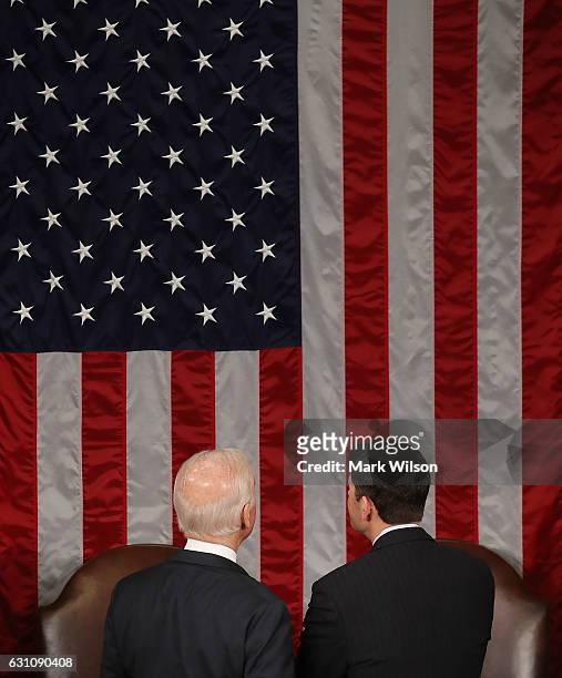 House Speaker Paul Ryan , talks with U.S. Vice President Joseph Biden, during the counting of the electoral votes from the 2016 presidential election...