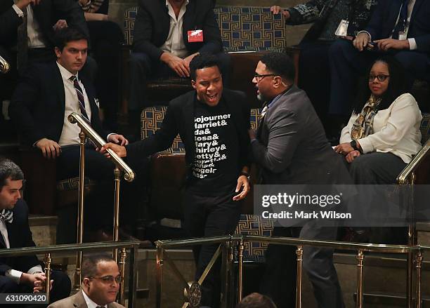 Protester is removed from the gallery during the counting of the electoral votes from the 2016 presidential election during a joint session of...