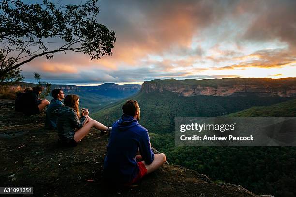 a group watch sunrise in the blue mountains. - blue mountain range stock pictures, royalty-free photos & images