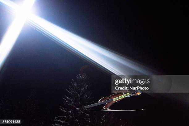 Kamil Stoch of Poland soars through the air during his first competition jump on Day 2 on January 6, 2017 in Bischofshofen, Austria.