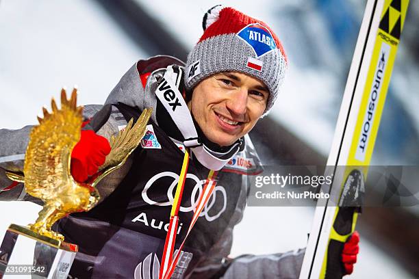 Kamil Stoch of Poland celebrates victory after the final round on Day 2 of the 65th Four Hills Tournament ski jumping event at...