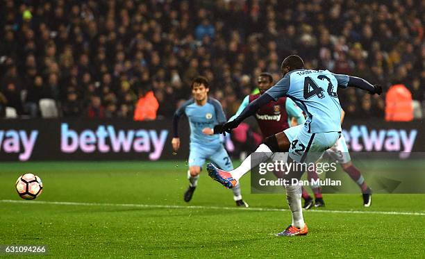 Yaya Toure of Manchester City scores his sides first goal from the penalty spot during The Emirates FA Cup Third Round match between West Ham United...