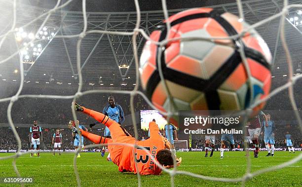 Yaya Toure of Manchester City scores his sides first goal from the penalty spot past Adrian of West Ham United during The Emirates FA Cup Third Round...