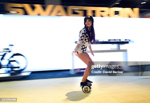 Model rides a Swagtron T3 hoverboard at CES 2017 at the Las Vegas Convention Center on January 6, 2017 in Las Vegas, Nevada. CES, the world's largest...