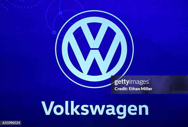 Logo for Volkswagen is shown on screen during a keynote address by Qualcomm Inc. CEO Steve Mollenkopf at CES 2017 at The Venetian Las Vegas on...