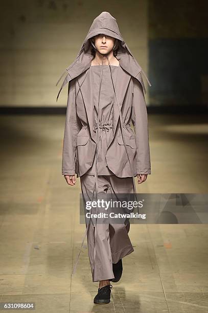 Model walks the runway at the Craig Green Autumn Winter 2017 fashion show during London Menswear Fashion Week on January 6, 2017 in London, United...