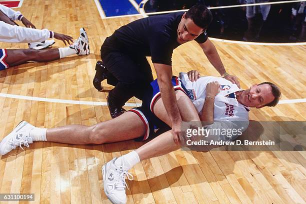 Doug Collins of the West Legends team stretches on the court during the Schick Legends Classic at 1992 All-Star Weekend on February 8, 1992 at...