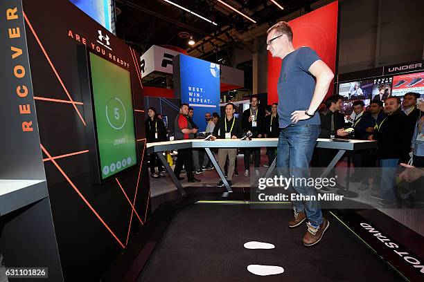 Morton Felsvang tries out a jump test at the Under Armour booth at CES 2017 at the Sands Expo and Convention Center on January 6, 2017 in Las Vegas,...