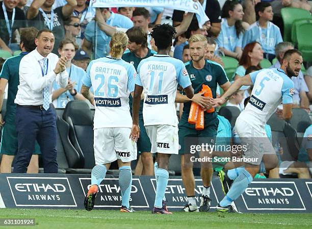 Ivan Franjic of City FC celebrates after scoring the first goal with City FC interim coach Michael Valkanis during the round 14 A-League match...