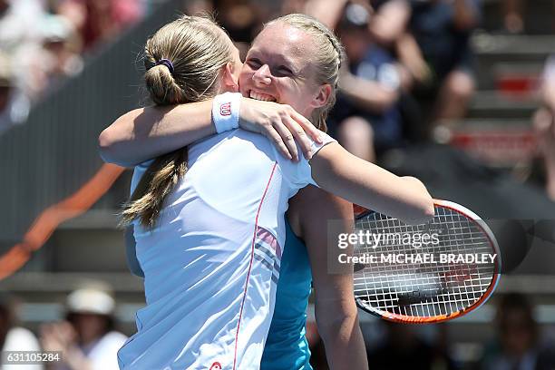 Netherland's Kiki Bertens and Sweden's Johanna Larsson celebrate their win against Netherland's Demi Schuurs and Renata Voracova from the Czech...