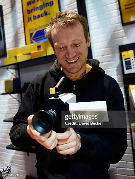 Kodak representative Josh Robertson demostrates Kodak's new Super 8 movie camera at CES 2017 at the Las Vegas Convention Center on January 6, 2017 in...